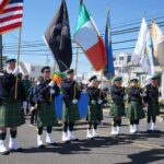 Parade participants hold up different flags at the North Wildwood St Patricks Day