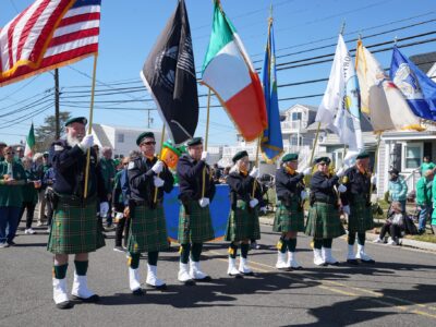 Parade participants hold up different flags at the North Wildwood St Patricks Day