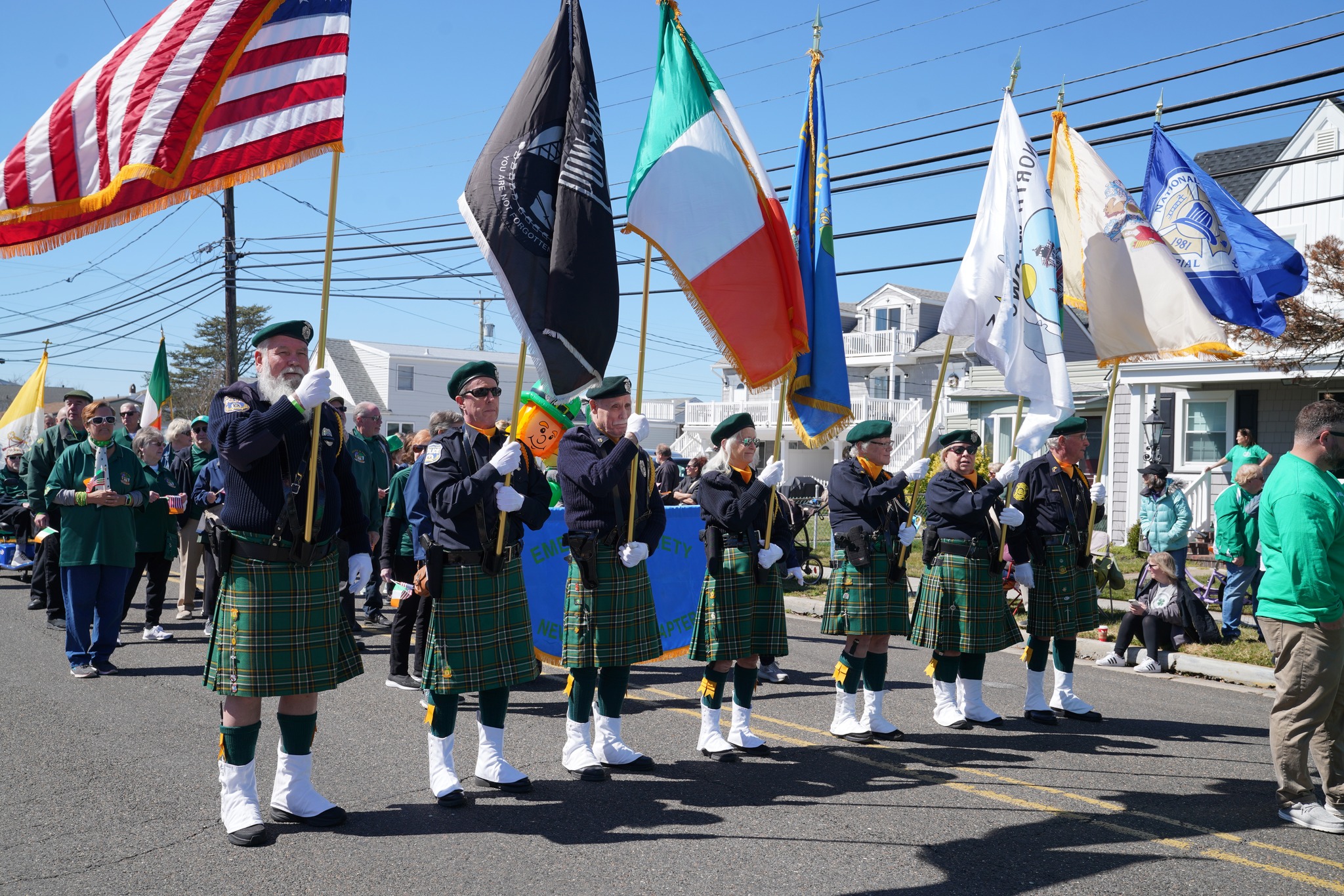 Parade participants hold up different flags at the North Wildwood St Patricks Day