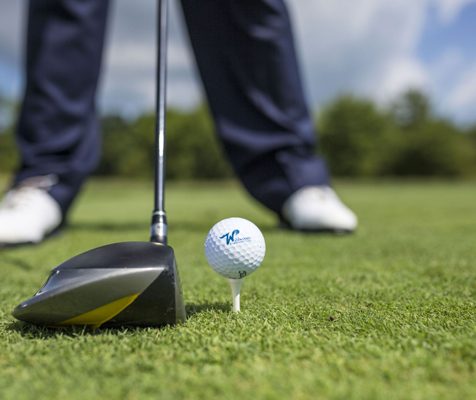 A close-up shot of a person golfing on a course near the Wildwoods.