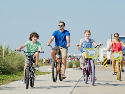 A family bikes through the Wildwoods.