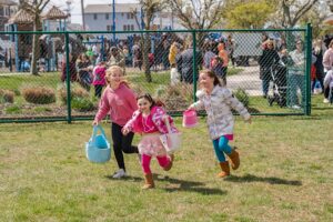 Children run during the Step Back Foundation Easter Egg Hunt