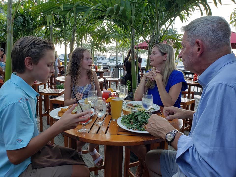 A family eats at Beach Creek.